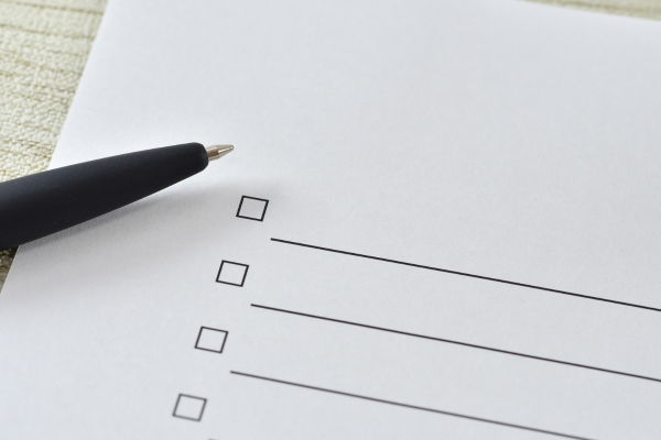 Picture of a checklist with a black pen