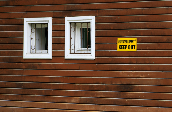 A Picture Of A House With A Keep Out Sign